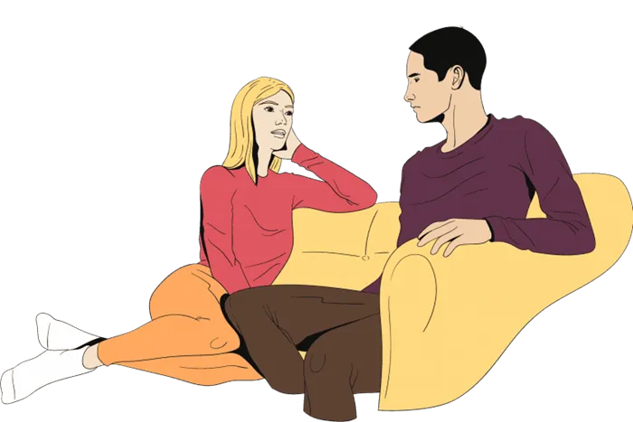 Парень и девушка сидят на диване